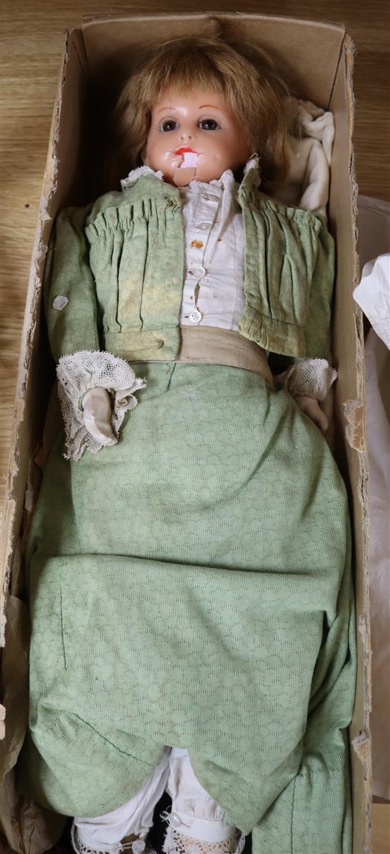 A Victorian poured wax shoulder head doll in period costume (a.f.)